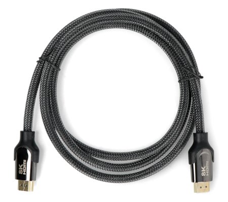 A black coiled USB cable lies on a white background.