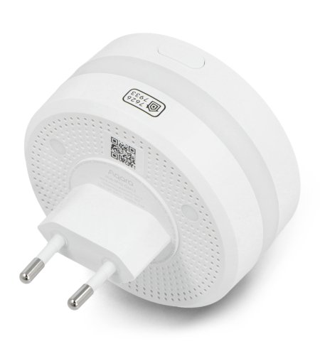 A round and white network gateway connected to a socket lies on a white background on the side of the power pin.