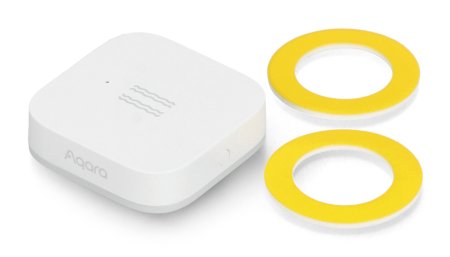 The white vibration sensor lies on a white background with mounting elements.