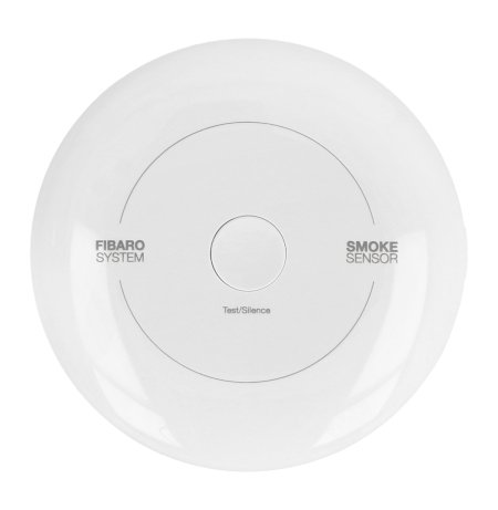 The white and round Fibaro smoke detector lies on a white background.